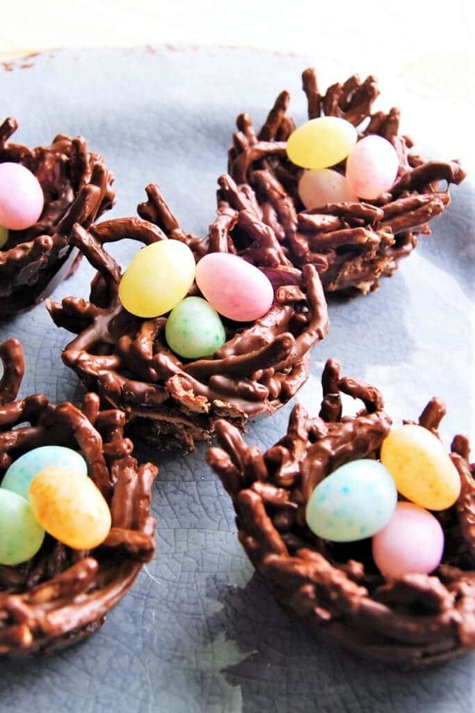 A light blue plate filled with vegan bird nest cookies.