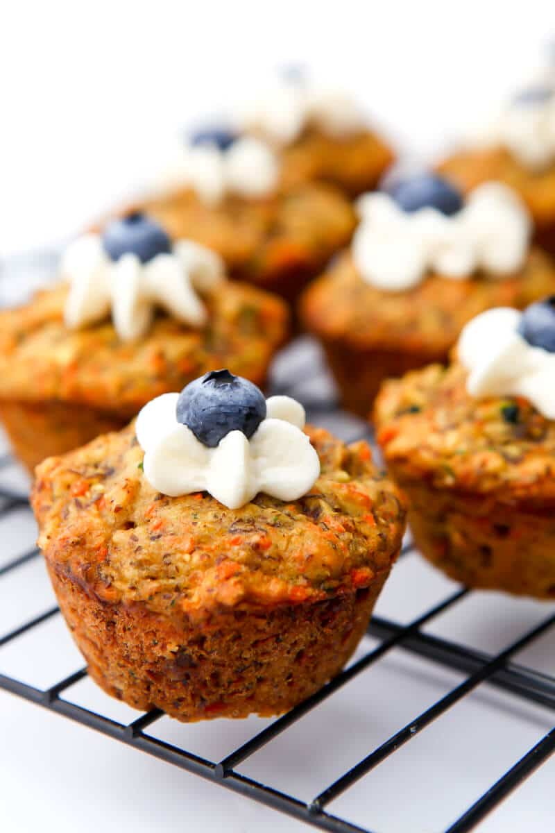 Healthy vegan muffins made of zucchini and carrots on a cooling rack.
