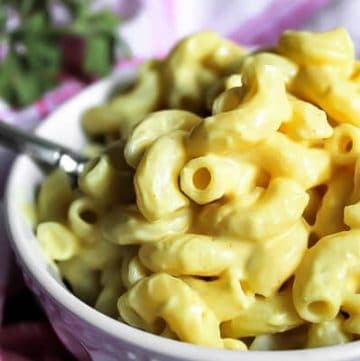 A white bowl filled with super easy vegan mac and cheese.