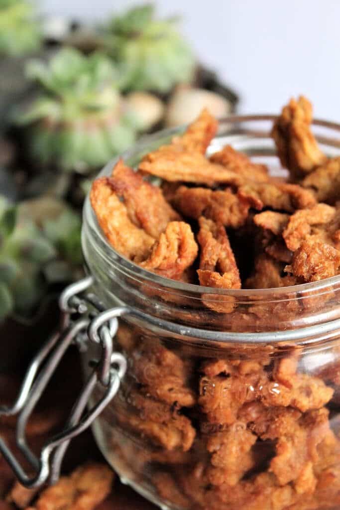 A jar full of vegan jerky made with butler soy curls.