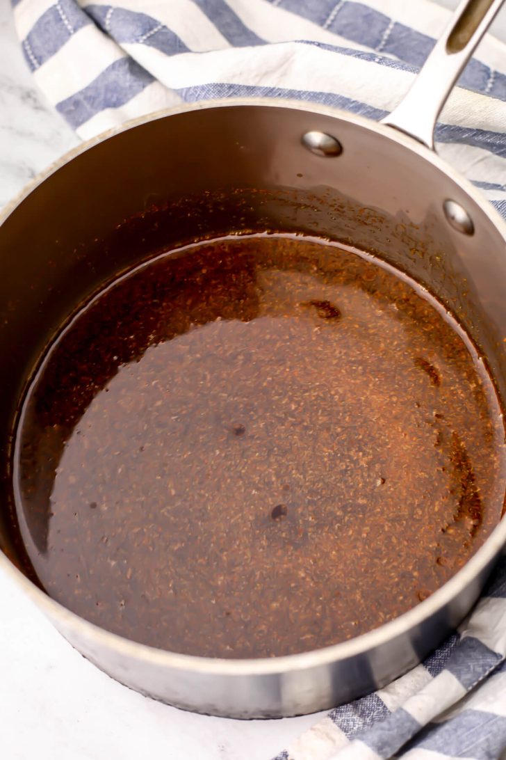A pot with a marinade to make vegan jerky from soy curls.