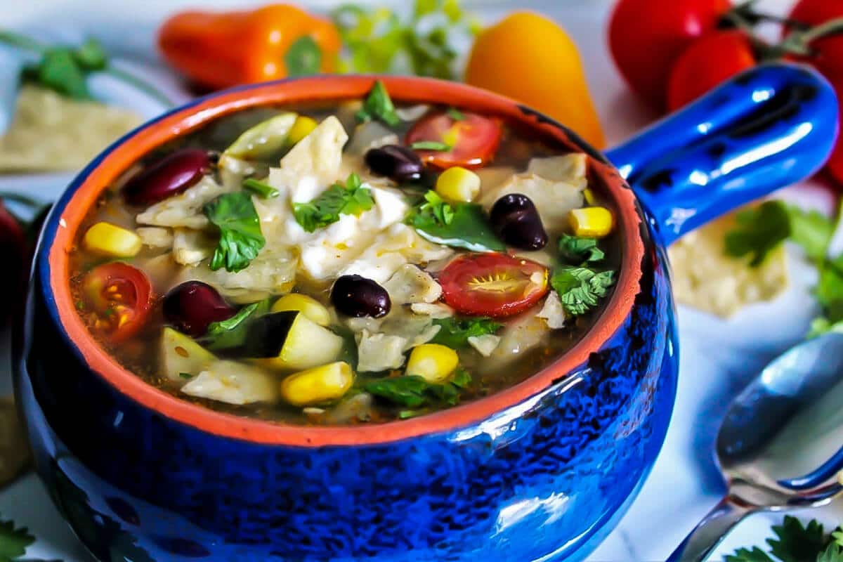 A blue bowl filled with vegan taco soup.