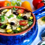 A bowl of gluten free vegan taco soup with vegan sour cream.