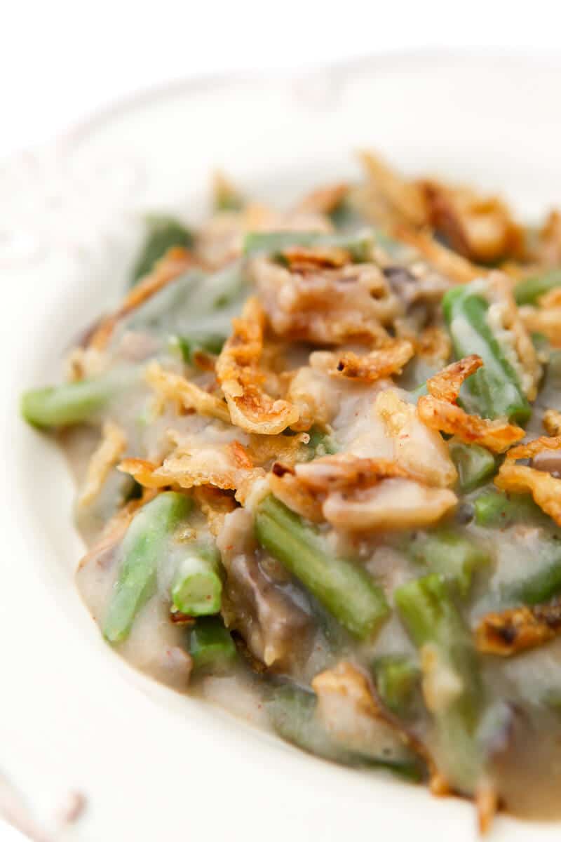 A white plate filled with vegan green bean casserole.