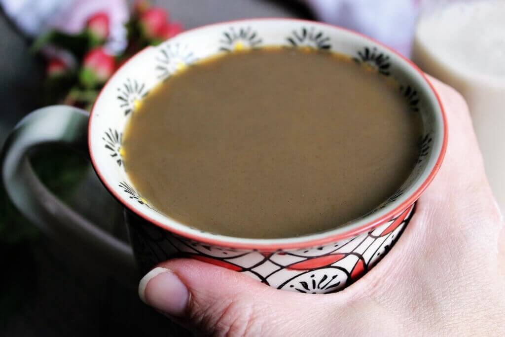 A close up of coffee with homemade coffee creamer in it.