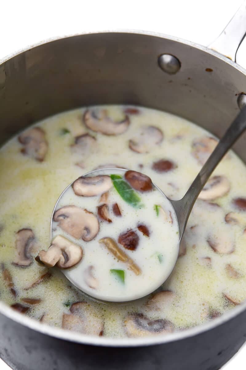 The vegan white gravy with mushrooms and peppers after the soy milk has been added.