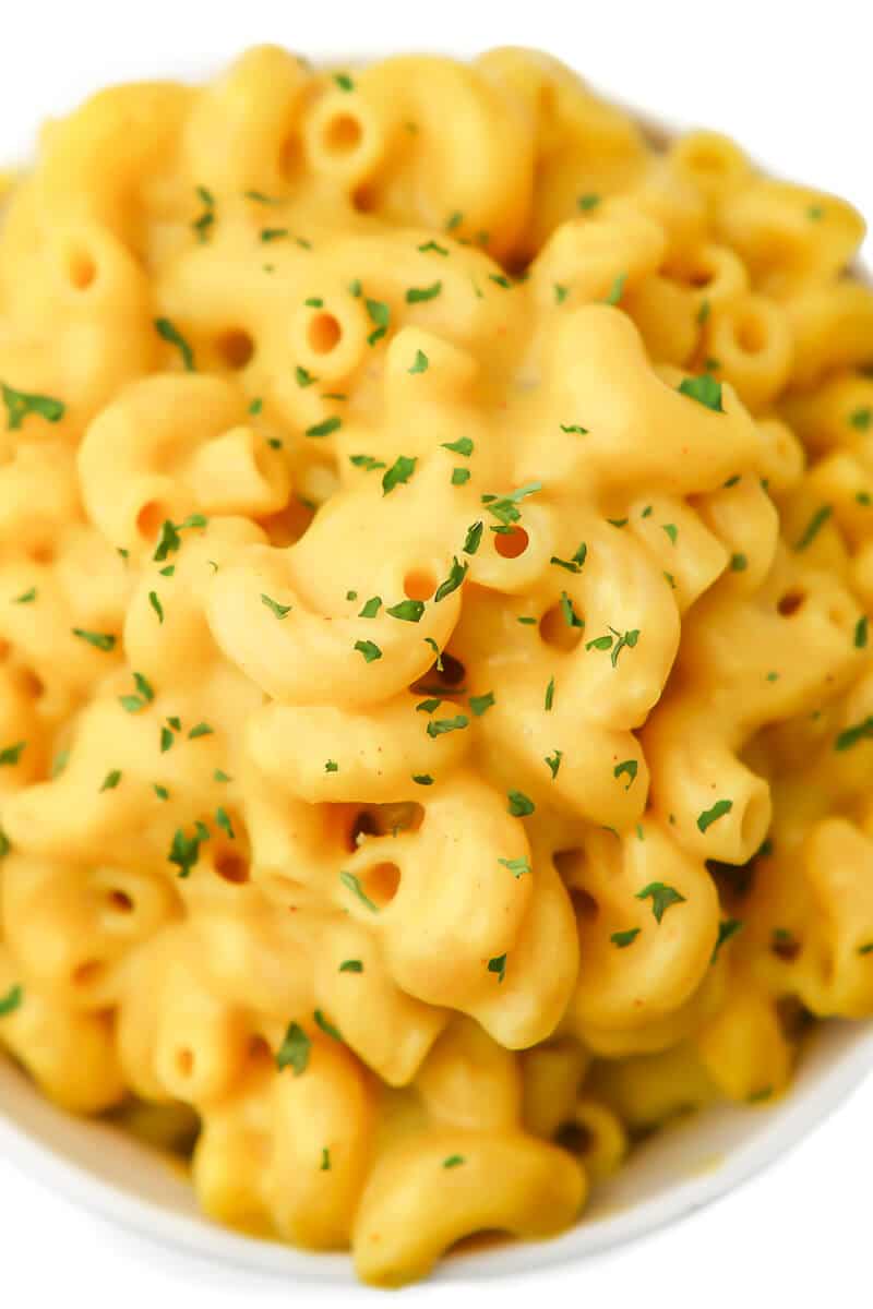 A close up of the top of a bowl of mac and cheese.