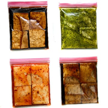 Four bags of tofu marinading in balsamic, cilantro lime, Thai chili, and sweet Asian marinades.