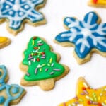 Cut out cookies in the shape of stars, Christmas trees, and snowflakes decorated with vegan royal icing.