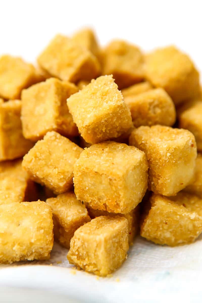 Cubed tofu that has been lightly breaded with cornstarch and fried.