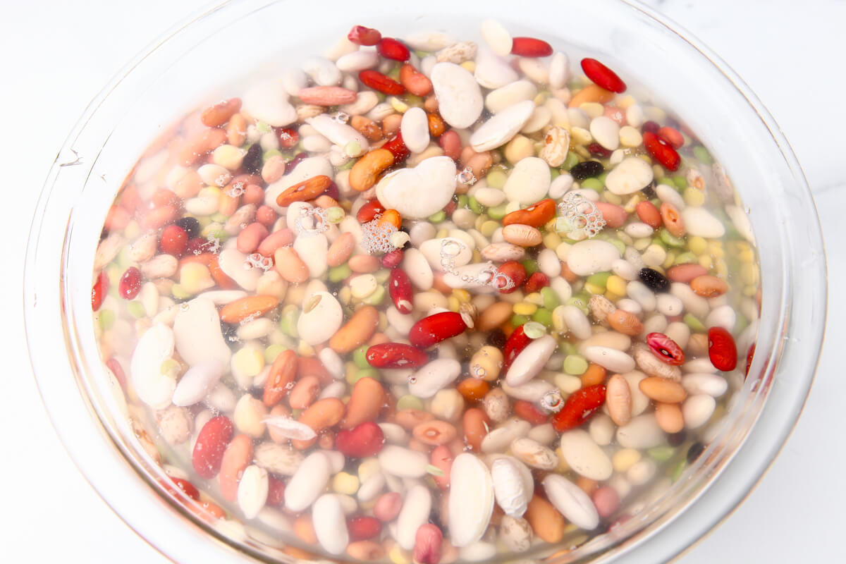 A bow of 15 beans pre-soaking before cooking.