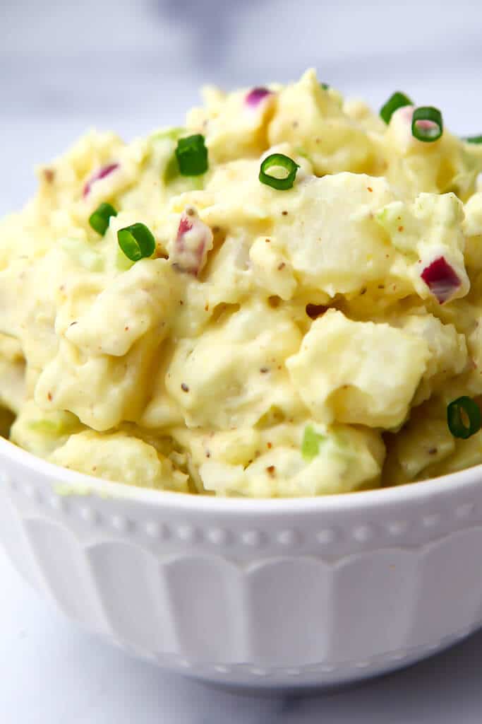 A close up of a creamy vegan potato salad.