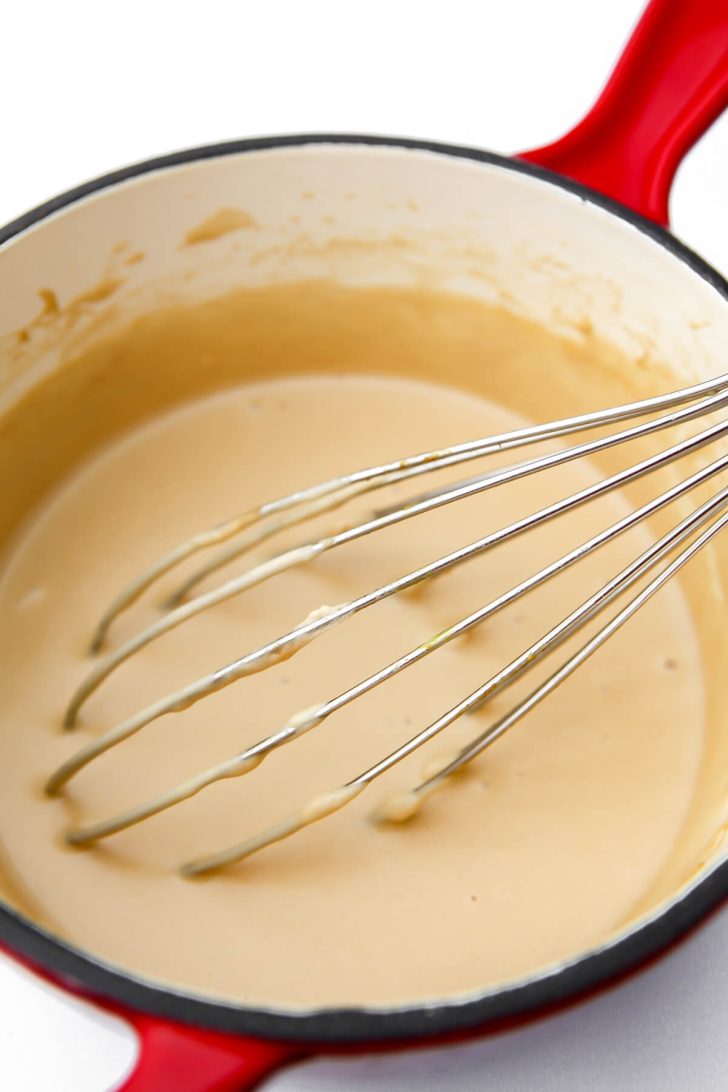 Vegan cheese after it has cooked for 4 minutes in a saucepan.