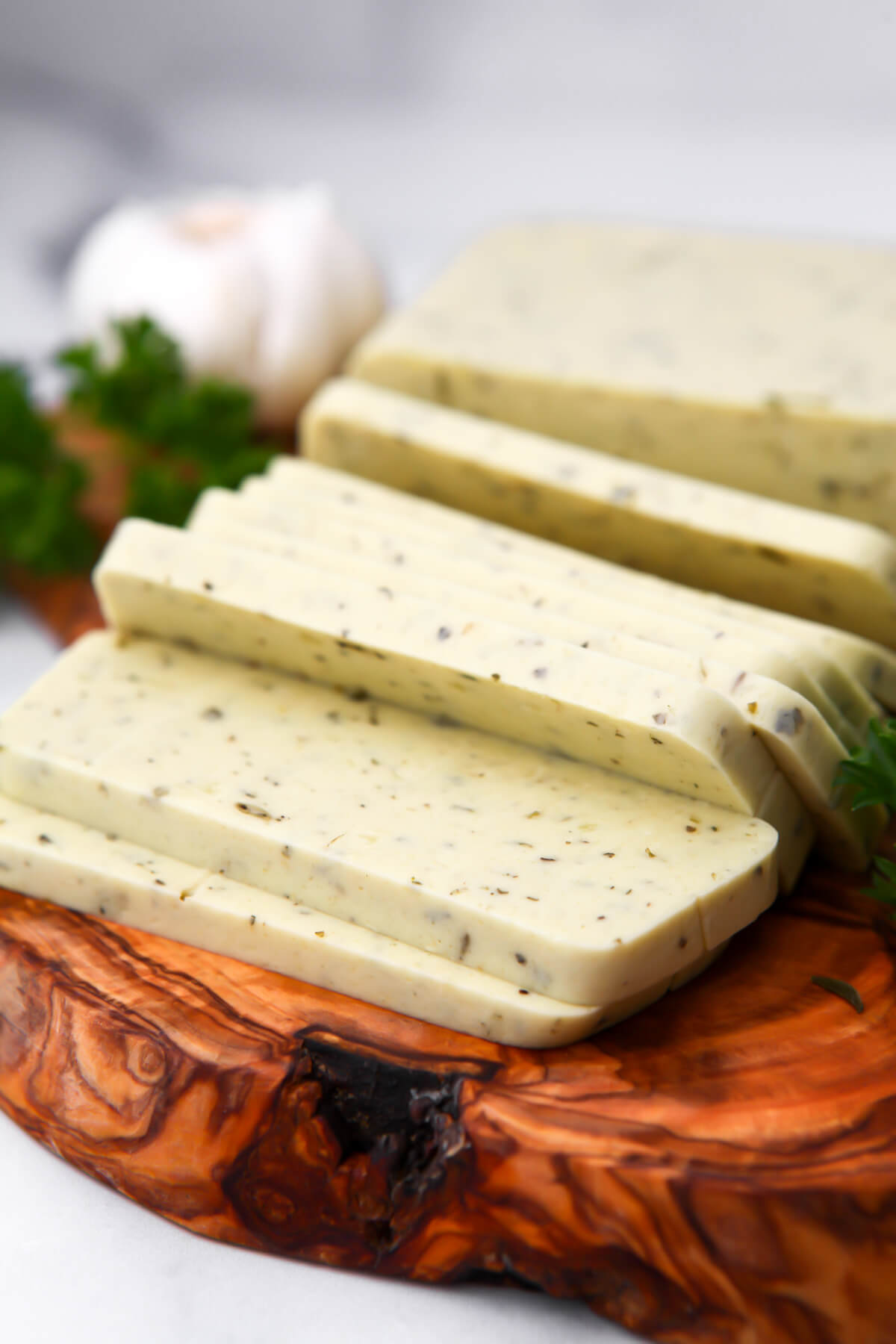 Homemade vegan cheese with garlic and herbs.