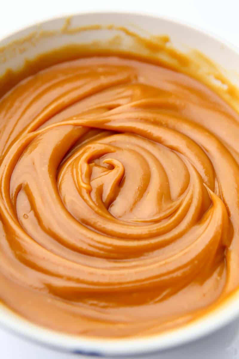 A top view of a bowl of peanut butter caramel.