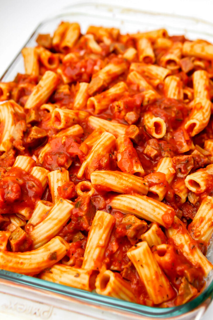 The top layer of vegan ziti added to a baking dish.