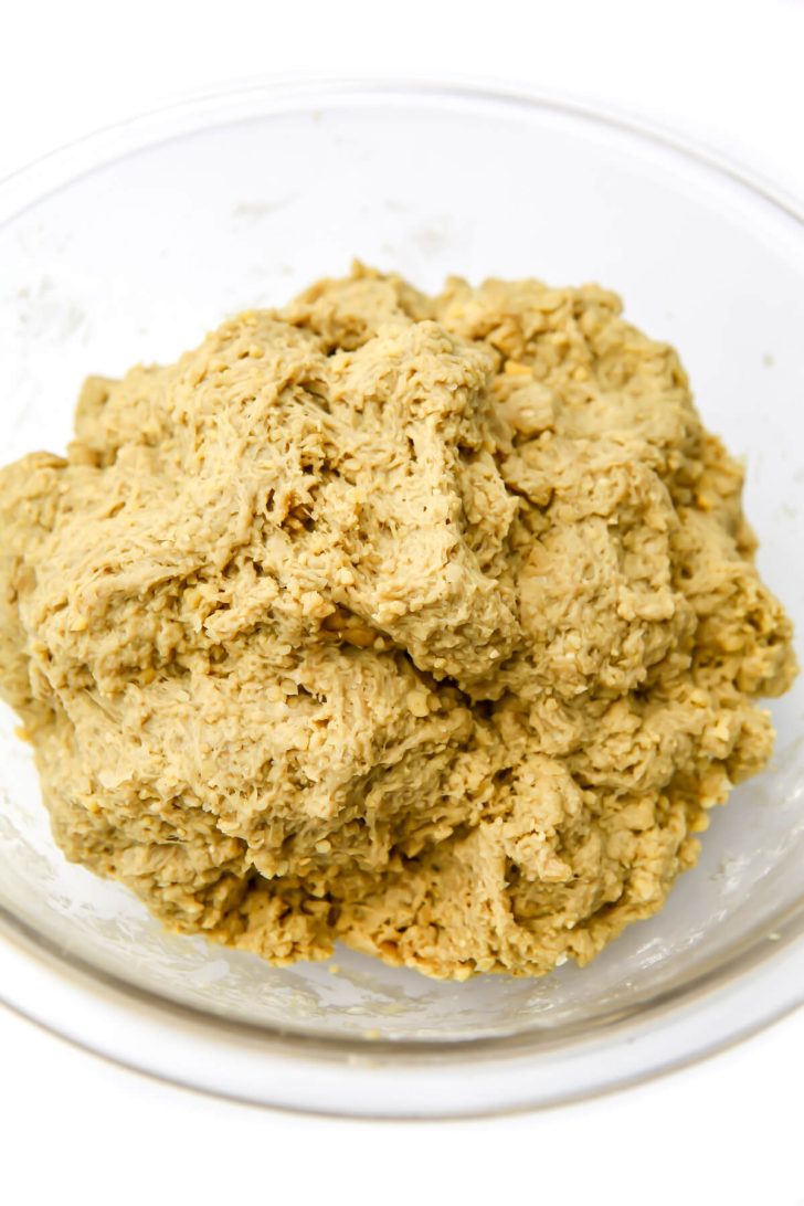 Seitan turkey dough mixed until firm in a glass bowl.