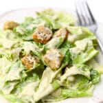 A close up of a plate full of vegan Caesar salad.