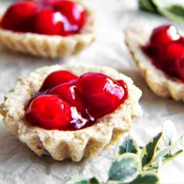 A tray of sand bakkels - little vegan tarts filled with cherry pie filling.