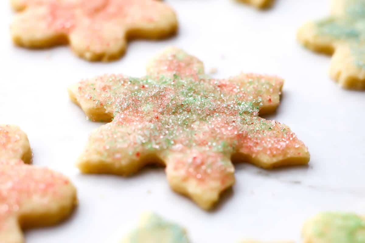 A sugar cookies decorated with colored sugar and no icing.