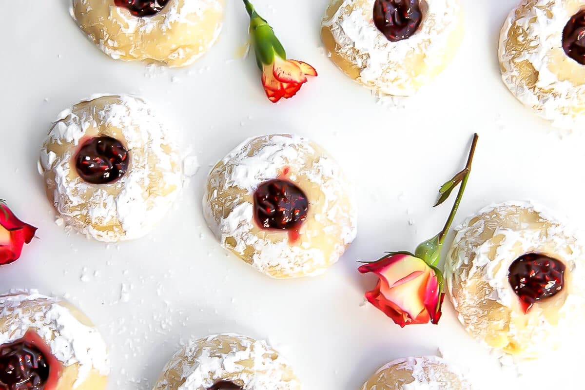 An overhead shot of thumbprint cookies on a tray.