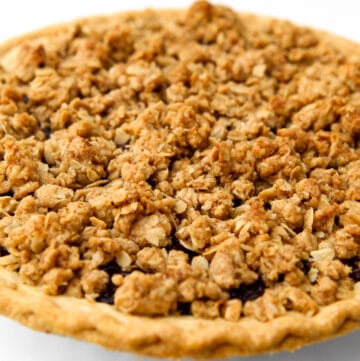 A pie with a vegan crumble topping baked until golden brown.
