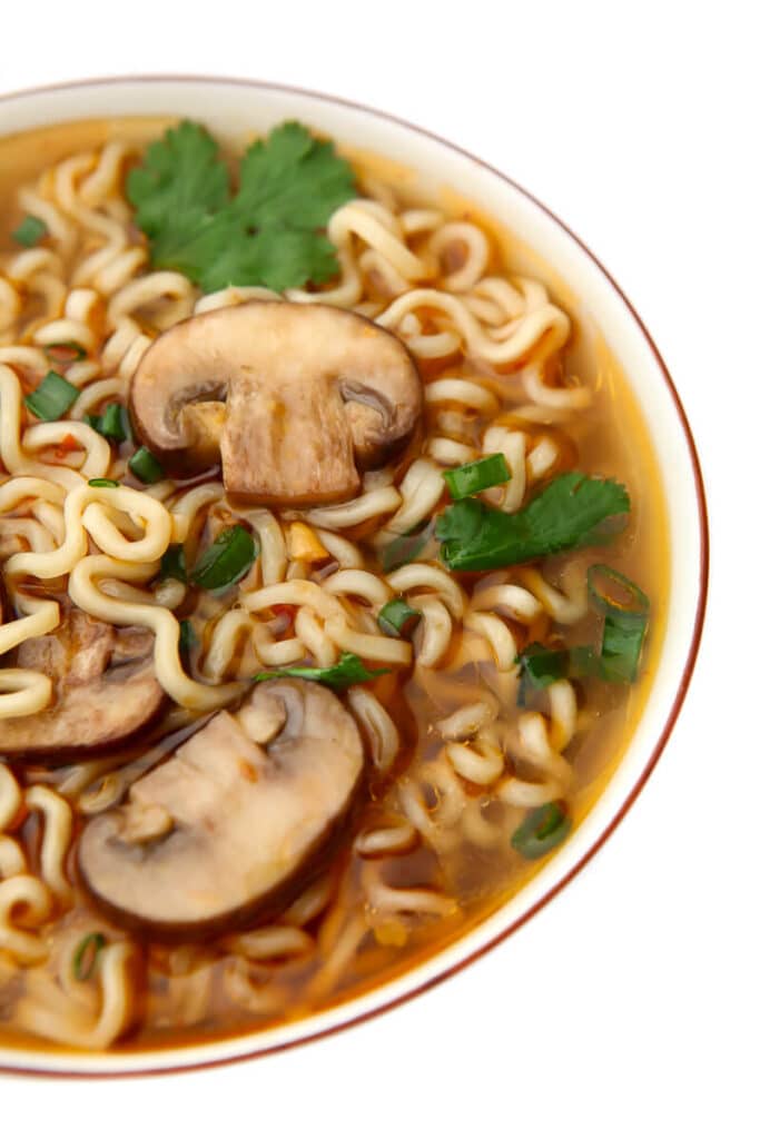 A close up of a bowl of soy sauce flavored ramen.