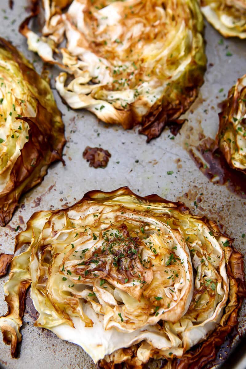 A top view of balsamic roasted cabbage on a cookie sheet.