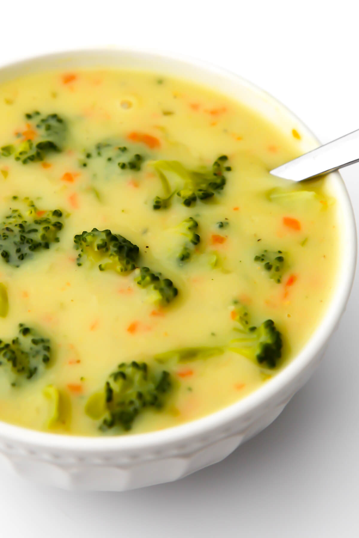 Vegan cream of broccoli soup in a white bowl.