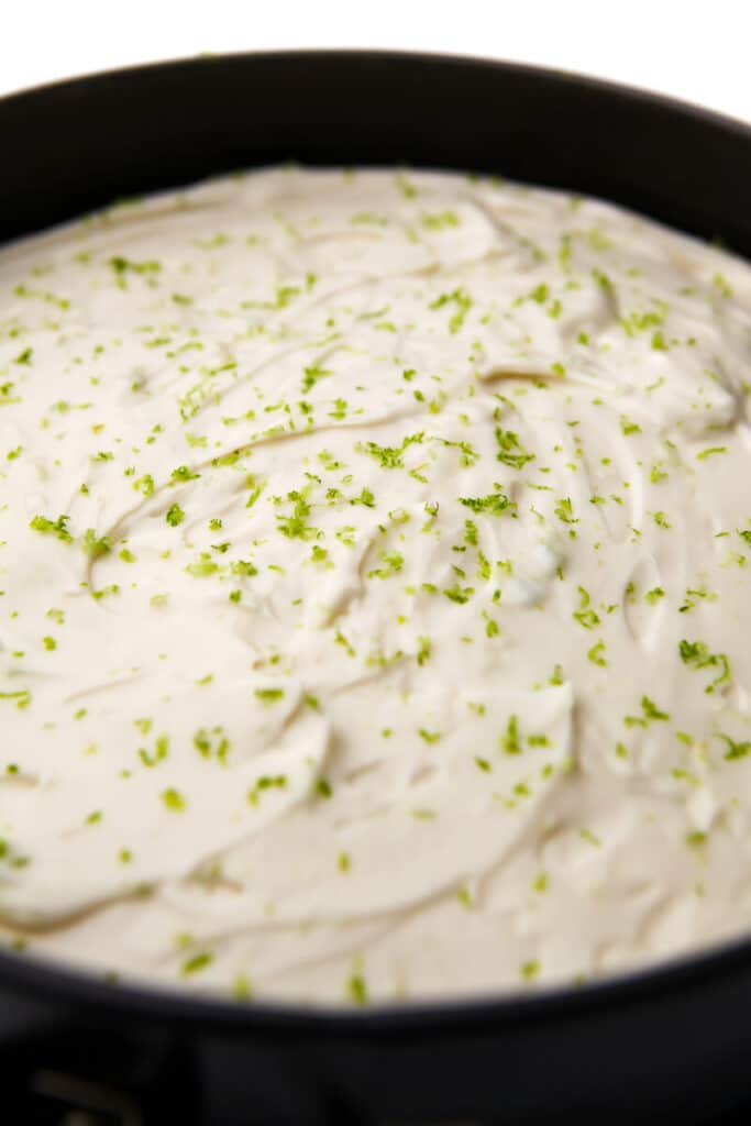 A dairy-free key lime pie after it has been poured into a springform pan.