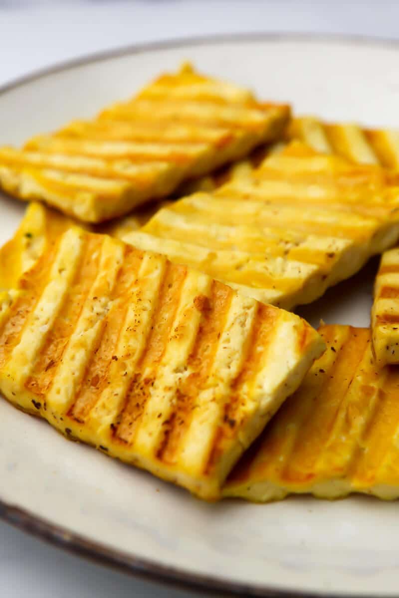 A close up of grilled vegan Halloumi cheese made from tofu.