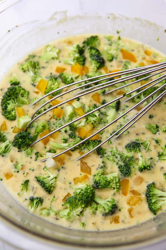 Chickpea egg batter with finely chopped vegetables tossed in.