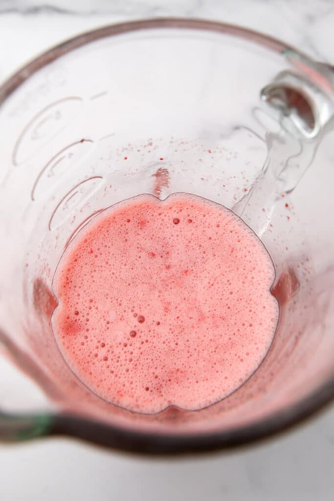 Strawberry pie filling in a blender.
