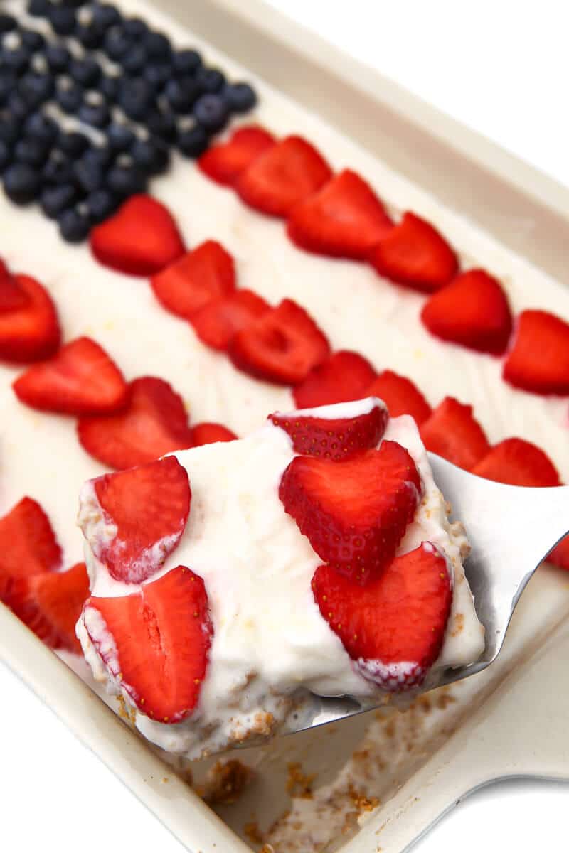 A vegan ice cream cake with berries on top in the shape of an American Flag.