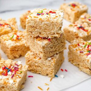 Vegan rice krispie treats with colorful sprinkles on top.
