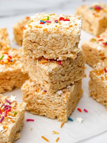 Vegan rice krispie treats with colorful sprinkles on top.