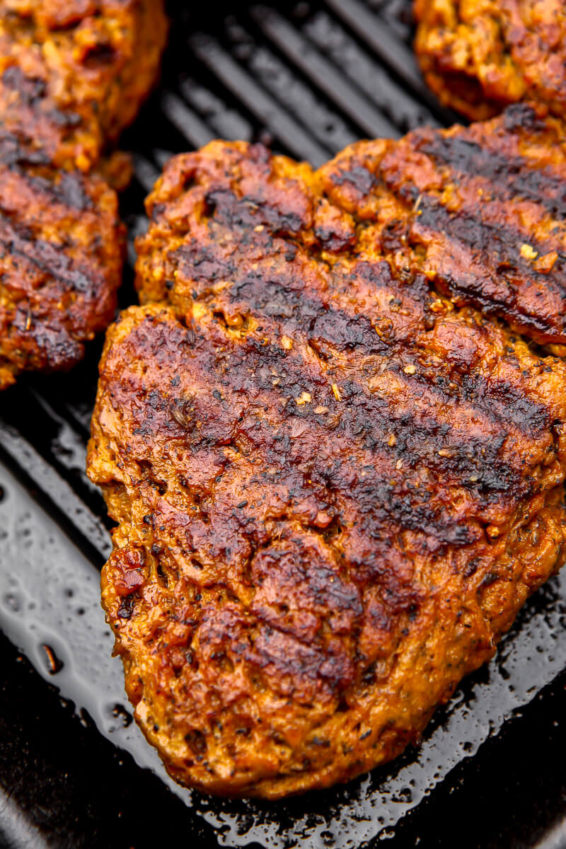 A close up of vegan steak being cooked on a skillet.