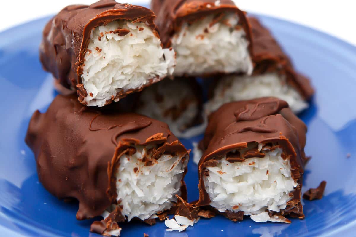 A close up of the inside of vegan mounds bars filled with coconut