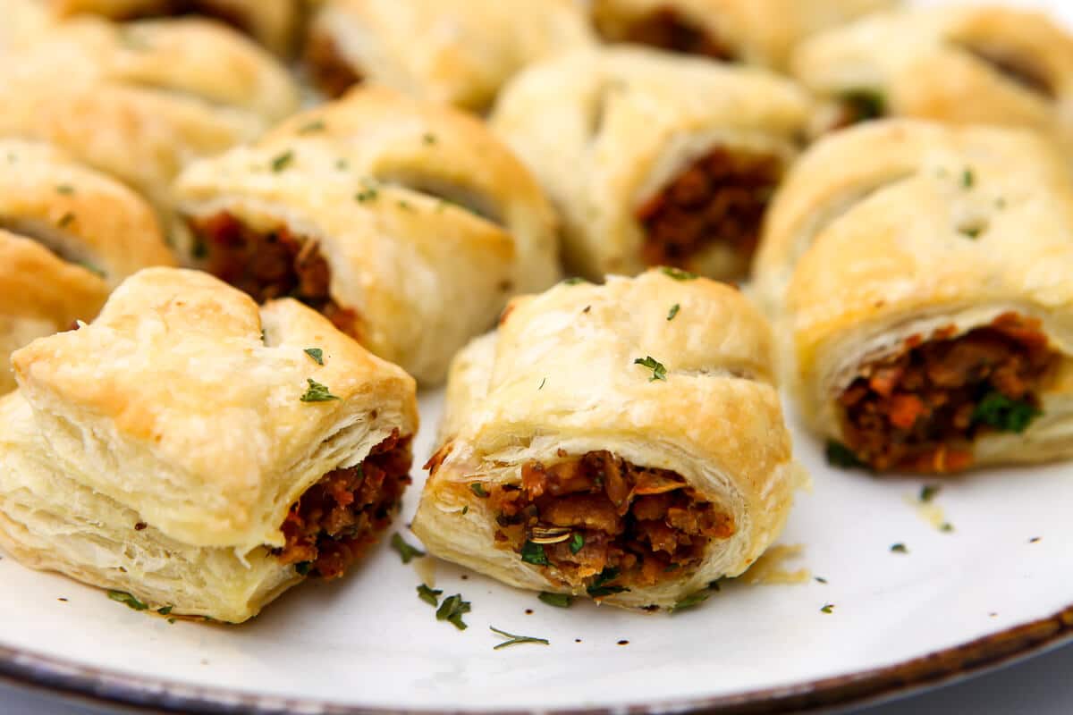 Faux meat sausage rolls made with TVP sausage baked in a pastry puff.
