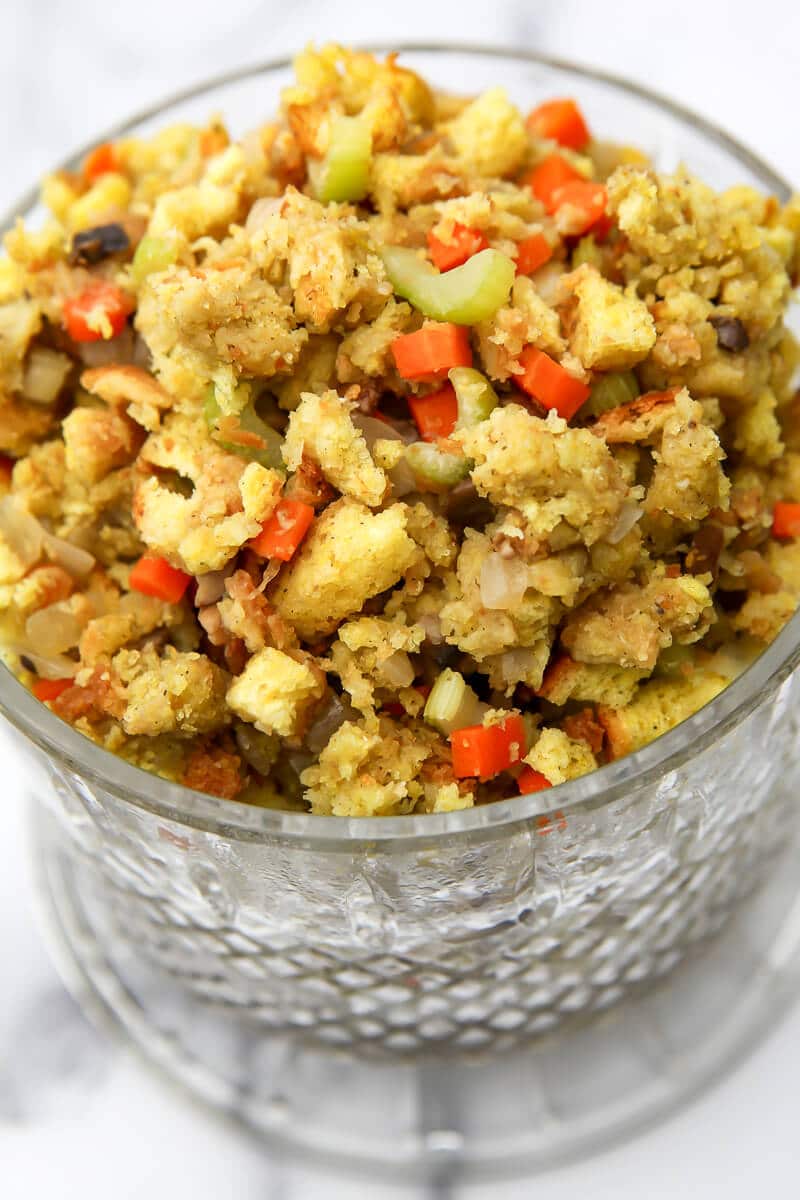 A glass bowl filled with vegan stovetop stuffing.