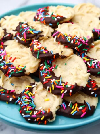 A blue plate filled with vegan butter cookies.