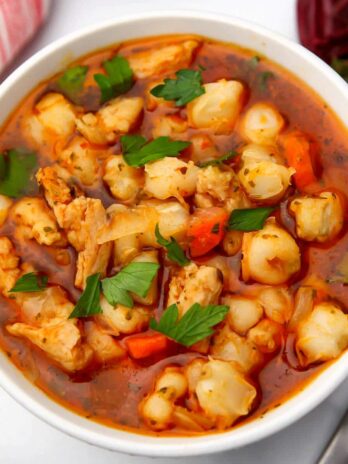 A top view of a bowl of vegan posole made with butler soy curls.