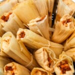 A close up of a pot full of vegan tamales ready to be steamed.
