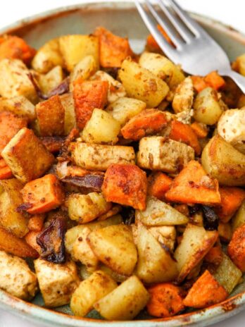 A plate full of roasted root vegetables and tofu.