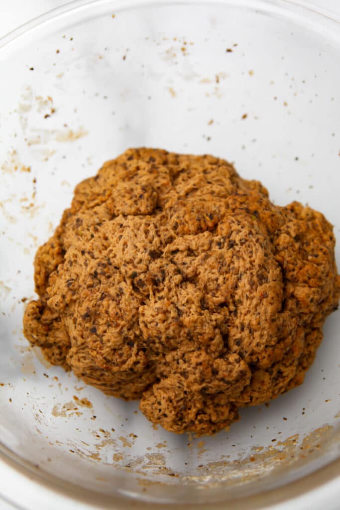 A frim ball of setain flavored to taste like beef before it is wrapped and steamed.