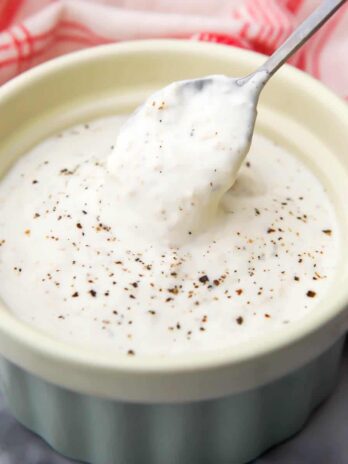A small bowl filling with creamy vegan horseradish sauce.