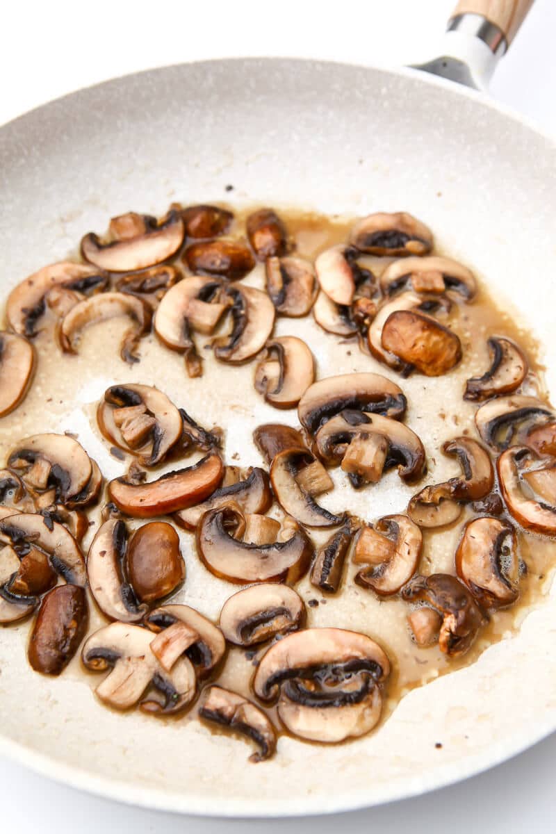 A skillet of sauteed mushrooms.