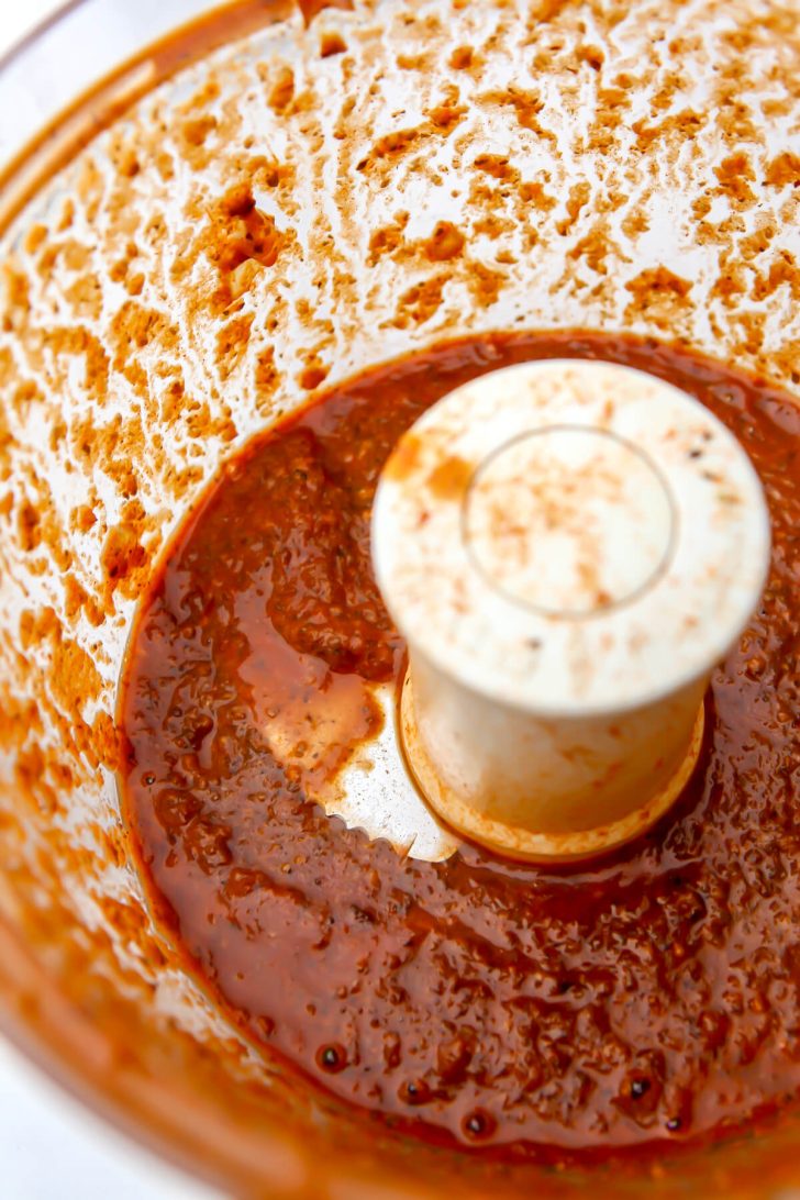 The beef flavored seitan broth blending in a food processor.