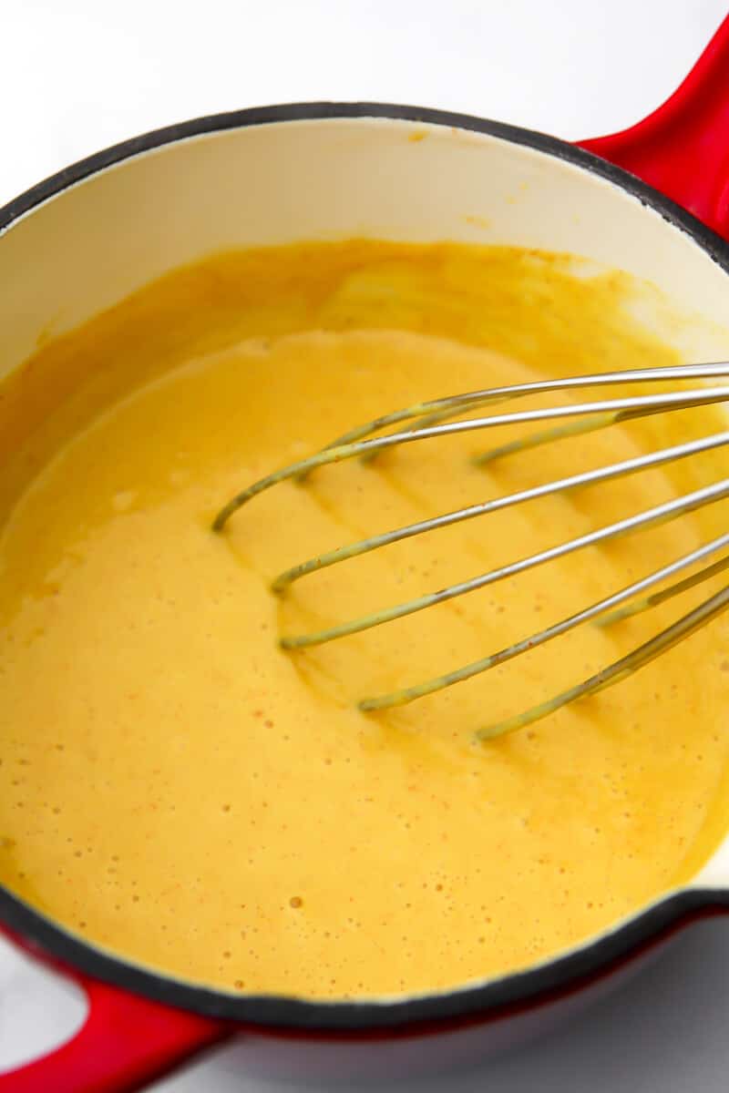 Cheese sauce made from canned coocnut milk that has been cooked and ready to combine with macaroni.