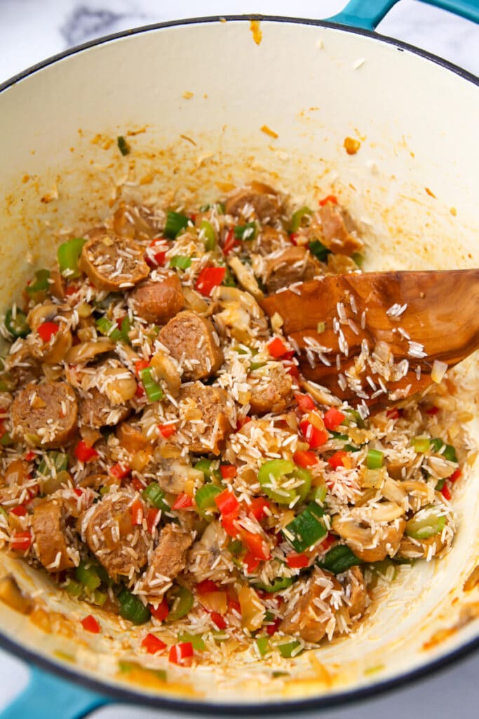 A pot of vegan jambalaya before the canned tomatoes and broth are added.
